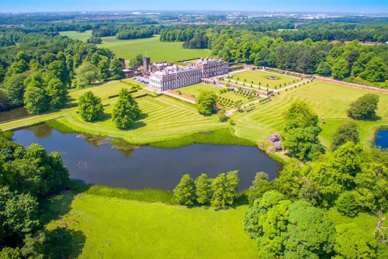 Birds eye view of Knowsley Hall and the lake within the private and extensive grounds.