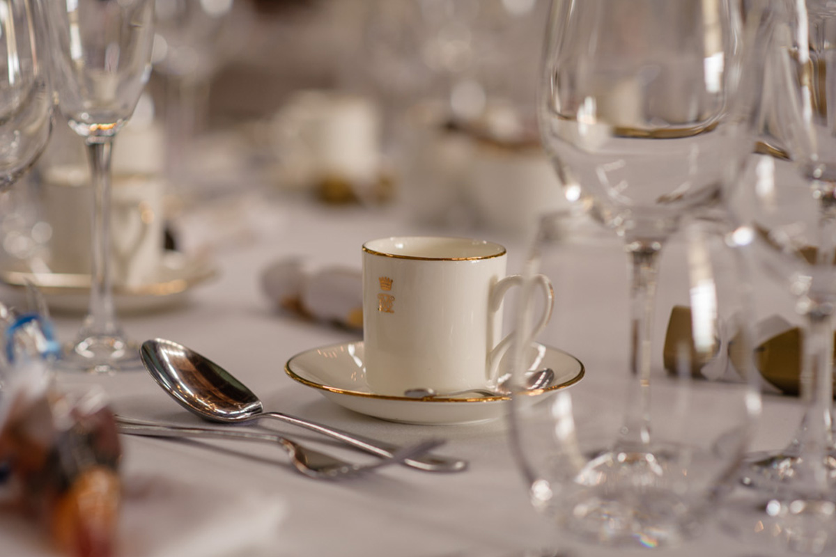 Close view of the layup of table placements with the Knowsley Hall logo