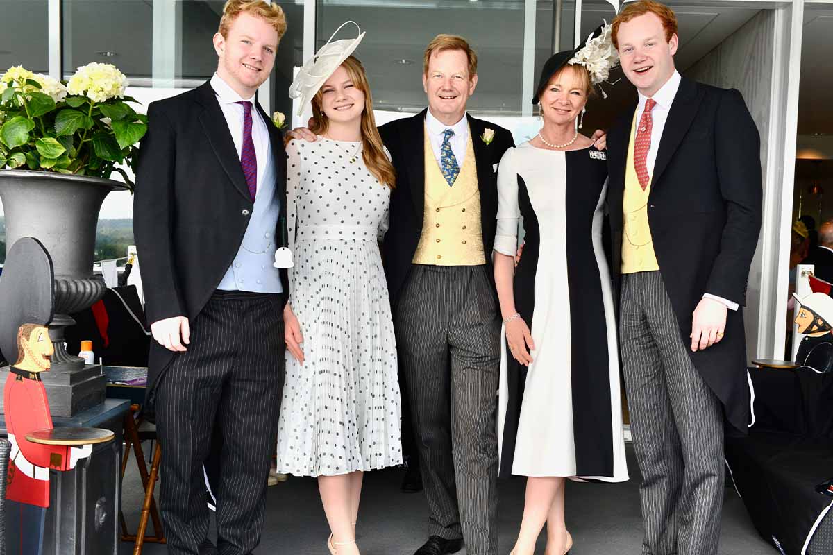 Family photograph of Lord & Lady Derby with their 3 children dressed up in their finery at the races.