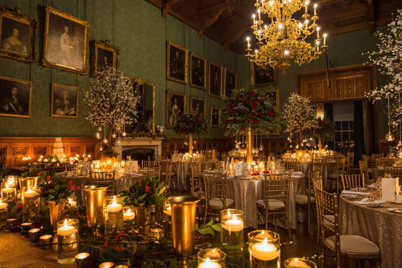 Christmas wedding dining room setting with Christmas flower arrangements and candles
