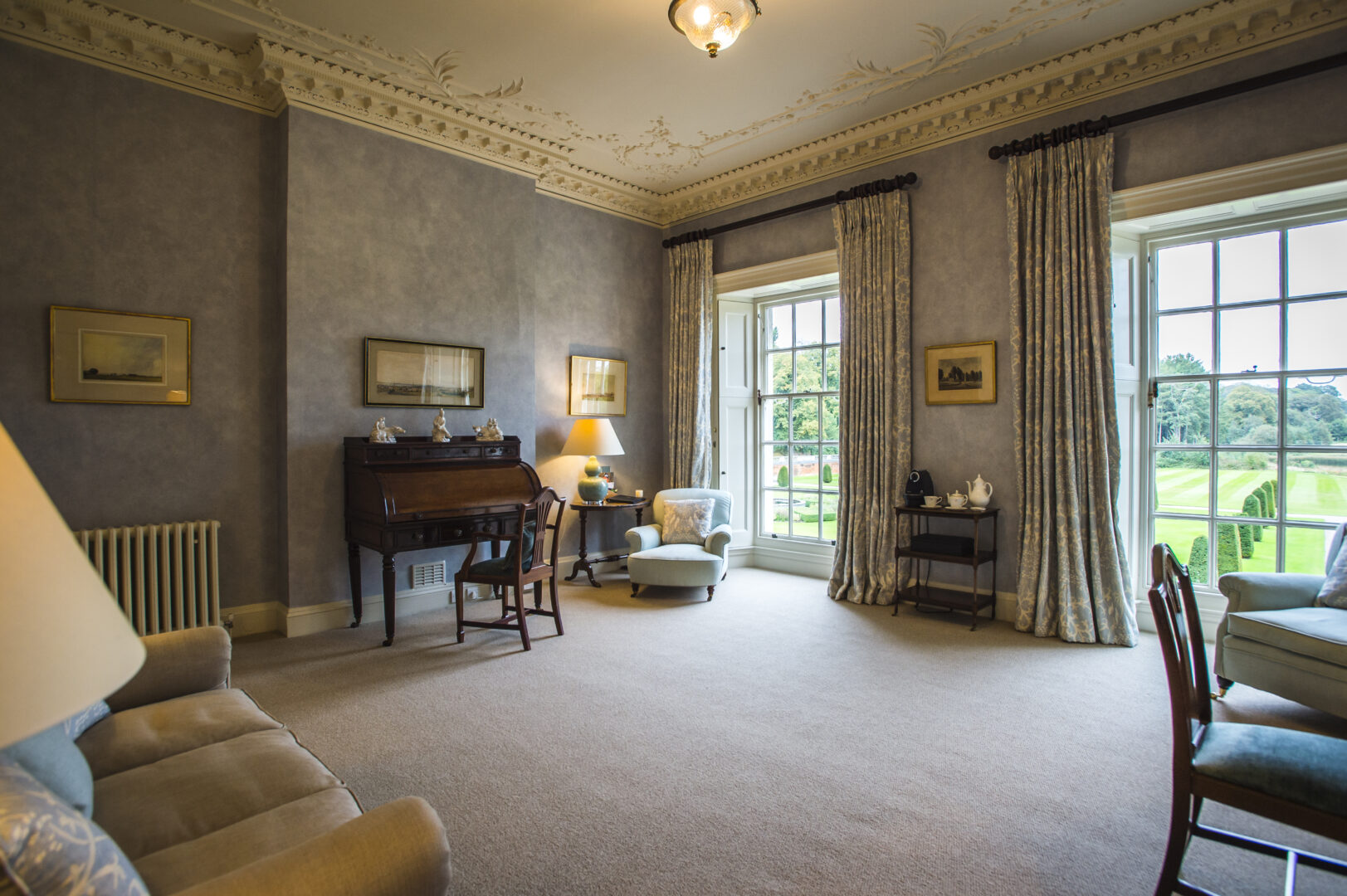 Lord Derby's Suite occupies a spacious dressing room with floor to ceiling windows which overlook the beautiful manicured gardens and fountain.
