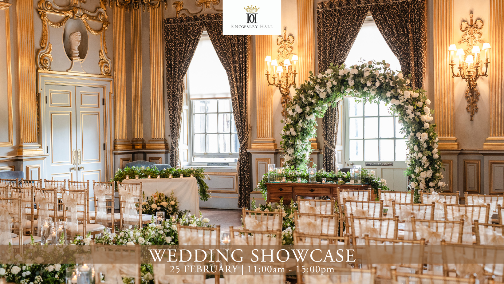A grand room with gold detail dressed with flowers and elegant chairs for a wedding ceremony