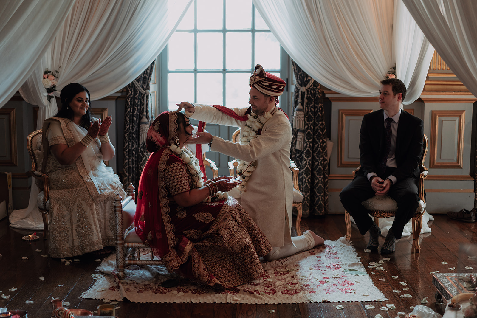 A Hindu wedding with a couple having a small sacred fire ceremony at Knowsley Hall