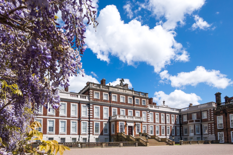 Knowsley Hall with blue skys and lilac flowers